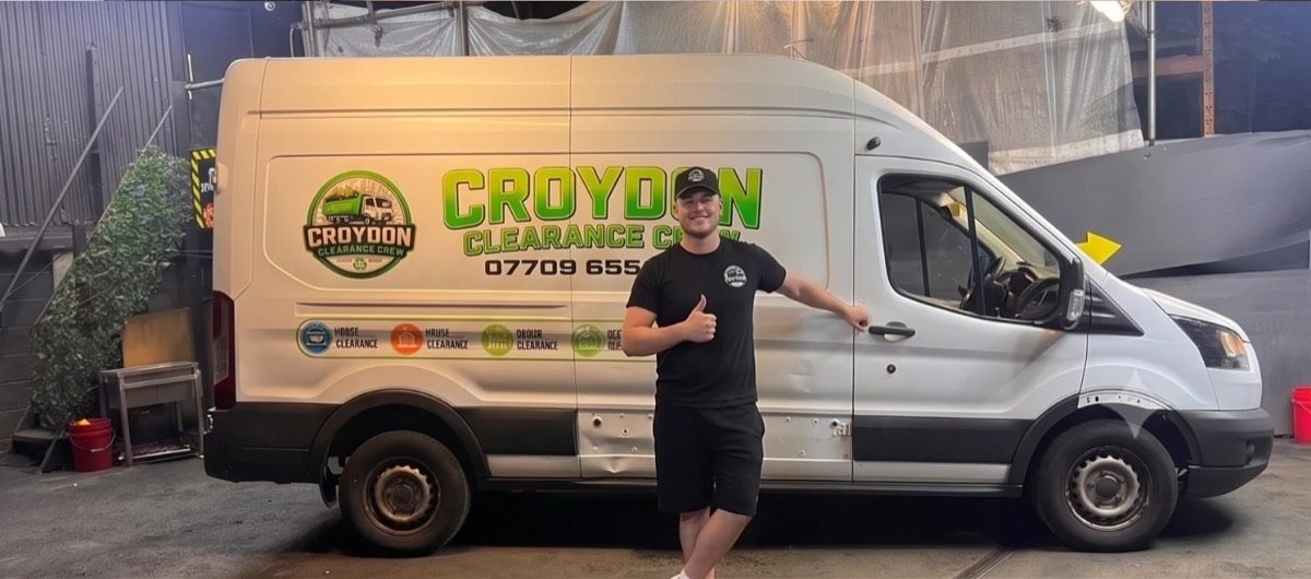 The owner of Croydon Clearance Crew standing by the clearance van